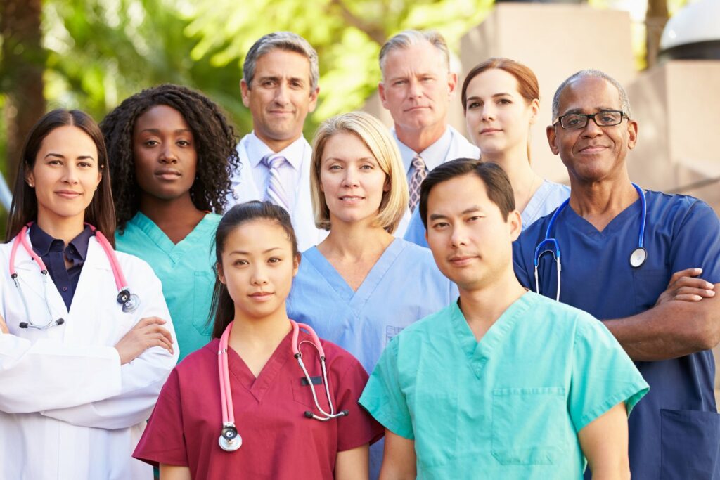 Outdoor Portrait Of Medical Team Smiling At Camera